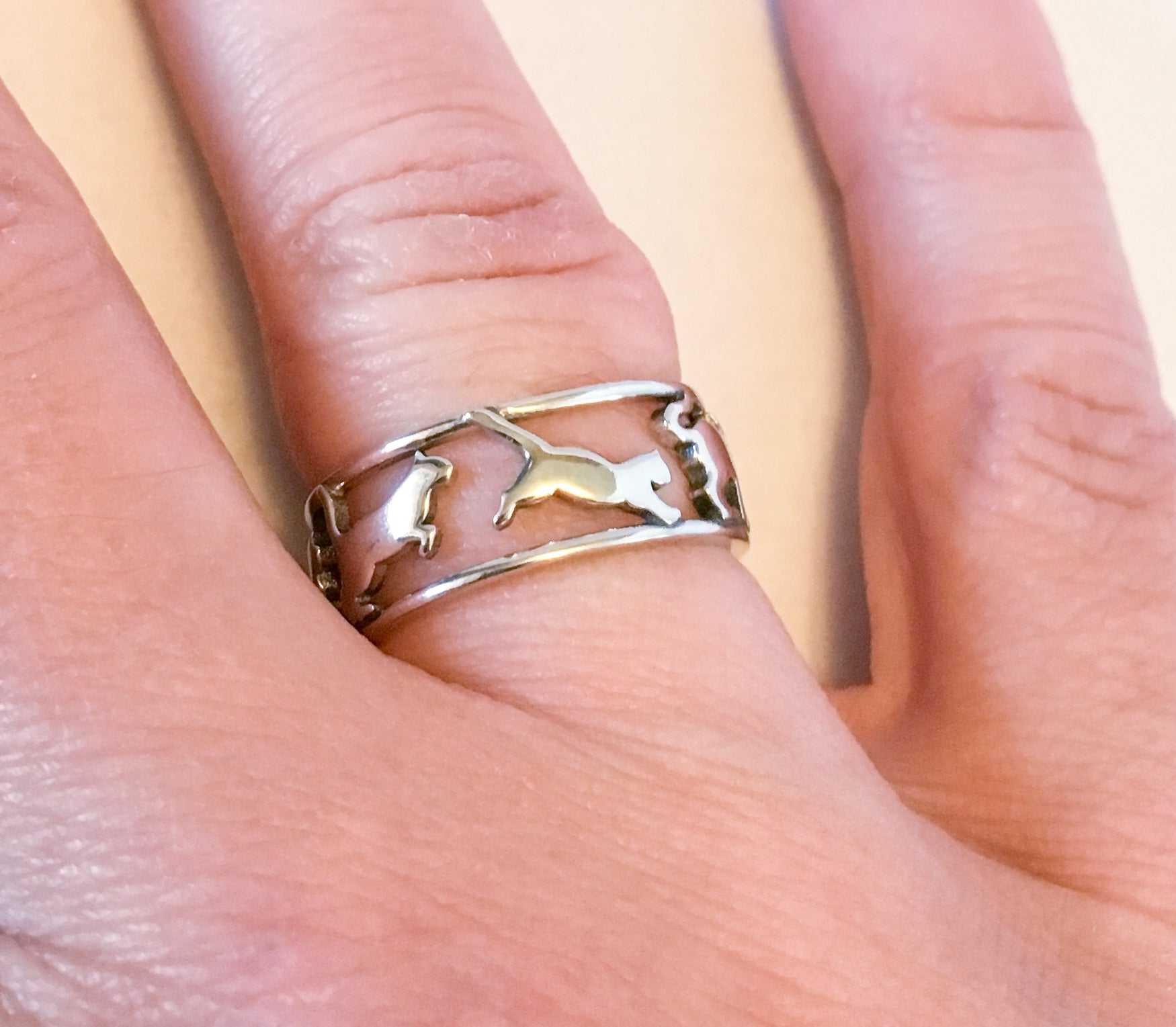 Silver cat ring on finger