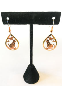 Rose gold tear drop cat earrings hanging